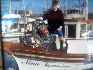 Barry loading crab pots on his boat